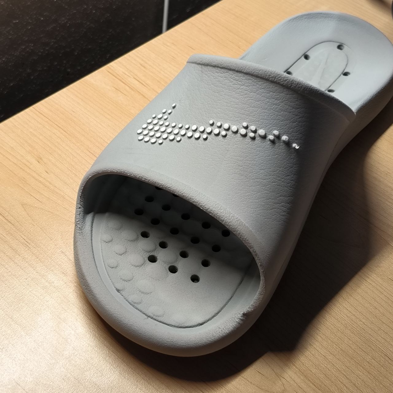 A simple Nike slipper is introduced as a potential base for embedding interactivity. It becomes the object of experimentation—turning an everyday item into a functional input surface.